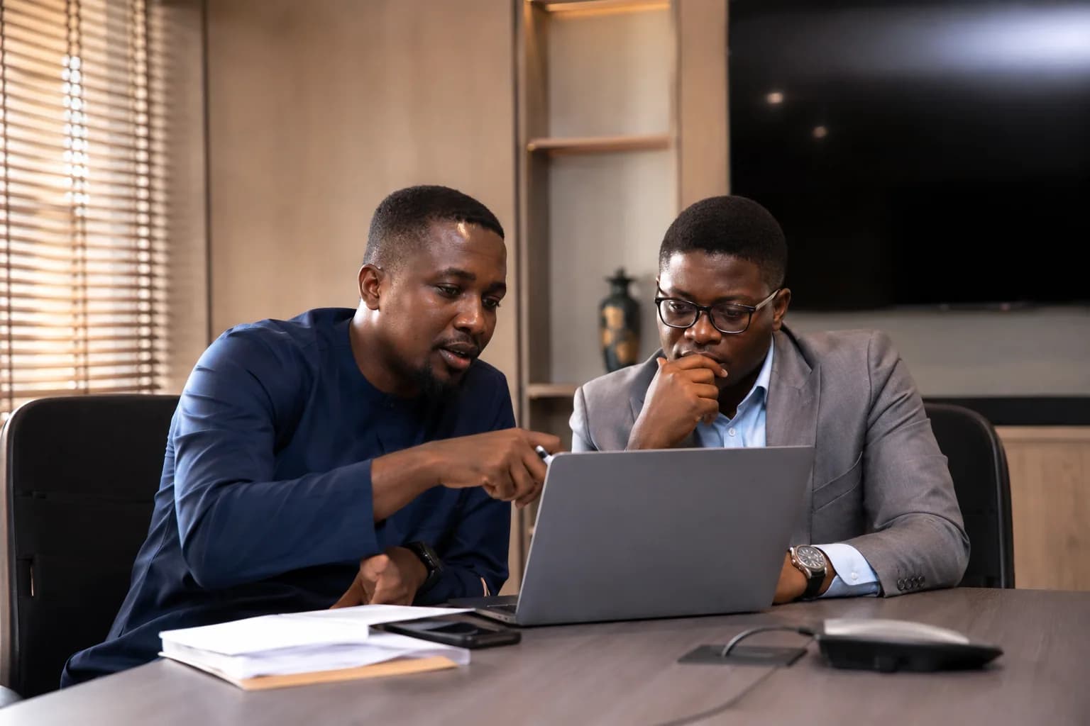 Consultants reviewing project milestones and documents