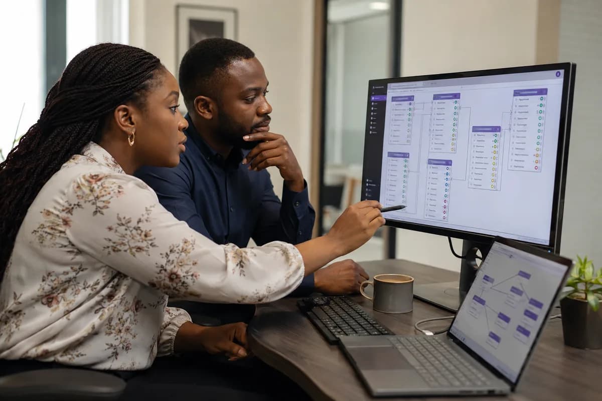 Data specialists reviewing database relationships and validation indicators