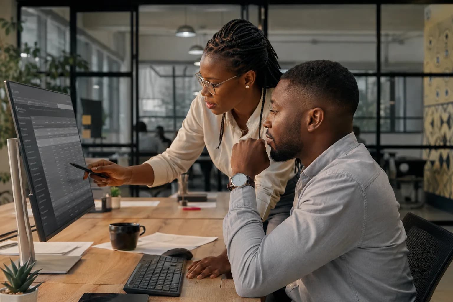 Finance operations professionals reviewing transaction reconciliation
